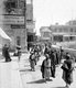 Palestine: Palestinians passing the German Palestine Bank, David Street, Jerusalem, c. 1910
