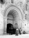 Palestine: Christian priests standing outside the entrance to the Armenian Convent, Jerusalem, c. 1910
